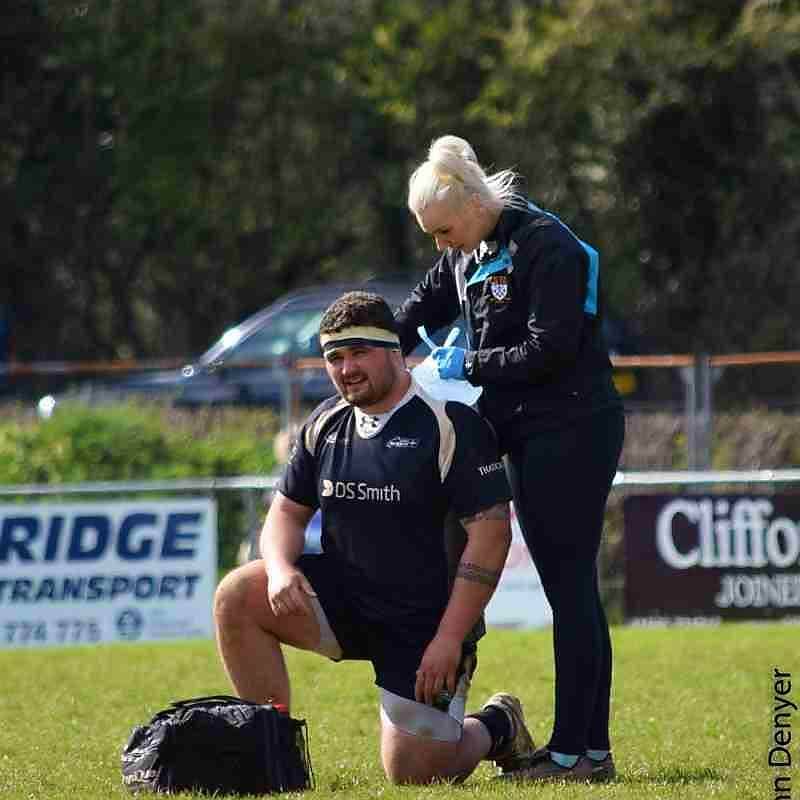 Lauren assisting a rugby player